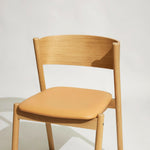 Oblique Dining Chair with Upholstered Seat | FSC® Certified Wood + Leather.